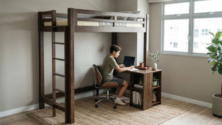 Teenager using a study desk under a wooden single loft bed in a modern HDB bedroom