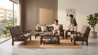 Wooden sofa set with armchairs, coffee table, and neutral decor in a spacious contemporary Singapore home