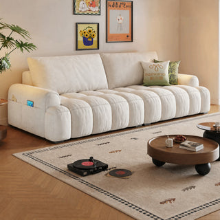 Cream cat-scratch sofa bed in a living room