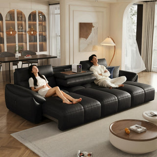 Black leather power sofa bed in a living room