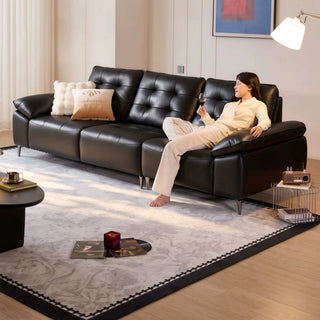 Black leather sofa in a living room