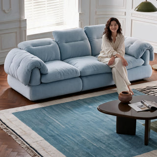 Light blue fabric sofa in a living room