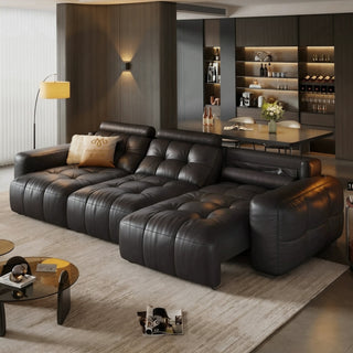 Black leather power sofa bed in a living room