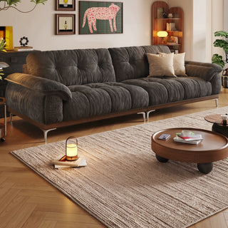 Cloud tufted fabric sofa in a living room