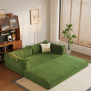 Olive-green frameless sofa bed in a living room