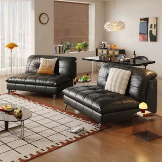 Black leather modular sofa in a living room