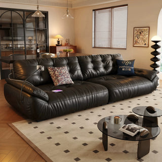 Black leather cloud sofa in a living room