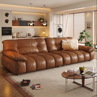 Cognac leather cloud sofa in a living room