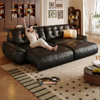 Black leather power sofa bed in a living room