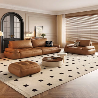 Cognac leather power sofa bed in a living room