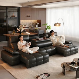 Black leather power sofa bed in a living room