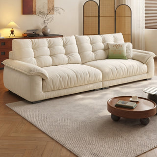 Cream cat-scratch cloud sofa in a living room