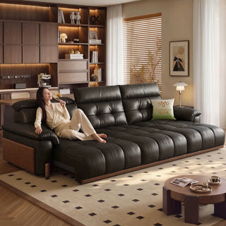 Black leather power sofa in a living room