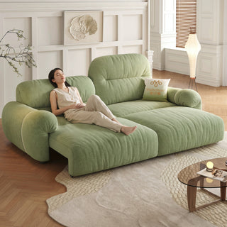 Green fabric sofa bed in a living room
