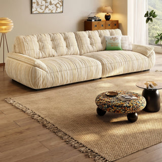 Cream striped chenille sofa in a living room