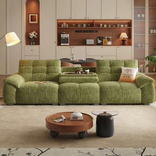 Green waffle-tufted sofa with flip-down table in a living room