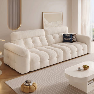 Cream cat-scratch fabric power sofa bed in a living room