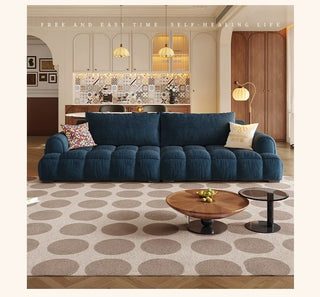 Deep-tufted fabric sofa