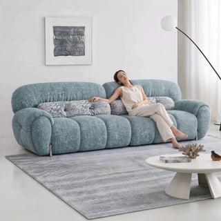 Blue boucle sofa in a living room