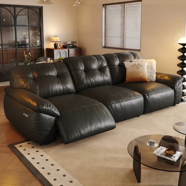 Black leather power recliner sofa in a living room