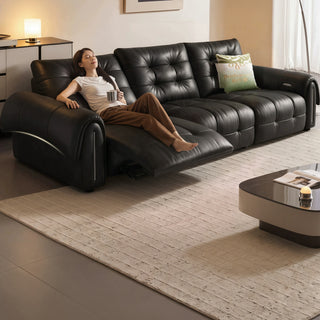 Black leather power sofa in a living room