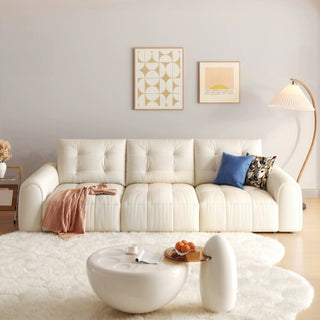 Cream cat-scratch fabric power sofa bed in a living room
