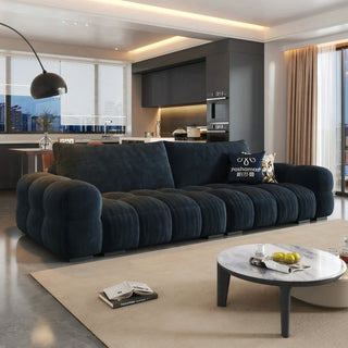 Navy ripple-chenille sofa in a living room