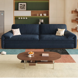 Navy air-cloud velvet sofa bed in a living room