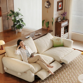 Cream fabric power sofa in a living room