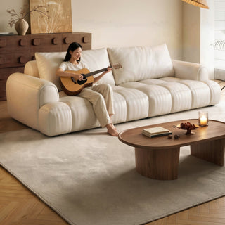 Cream leather puff sofa in a living room