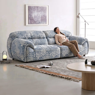 Blue textured chenille sofa in a living room