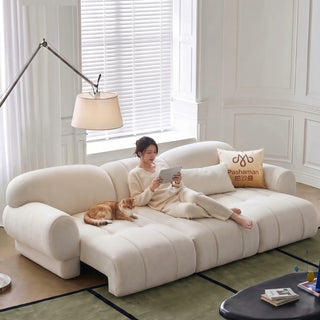 Cream fabric sofa bed in a living room