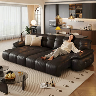 Black leather power sofa bed in a living room