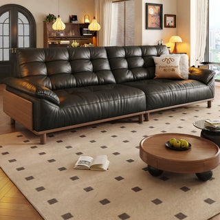 Black leather sofa with solid rubberwood side panels