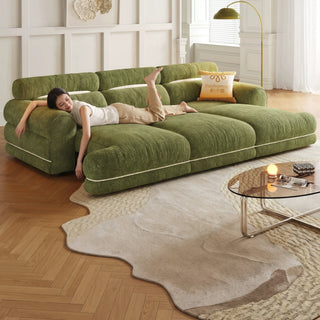 Green chenille power sofa bed in a living room