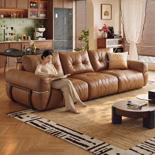 Tan oil-wax leather sofa in a living room