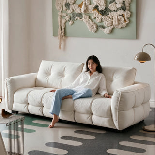 Cream boucle chenille sofa in a living room