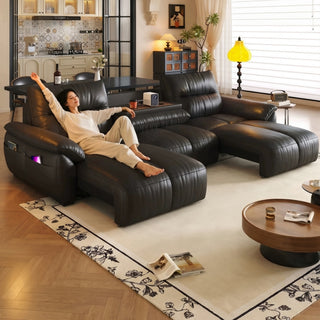 Dark brown leather power recliner sofa in a living room