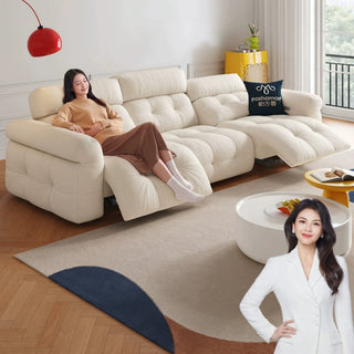 Cream cat-scratch fabric power recliner sofa in a living room