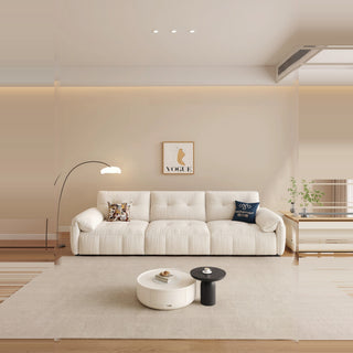 Cream cat-scratch fabric power sofa bed in a living room