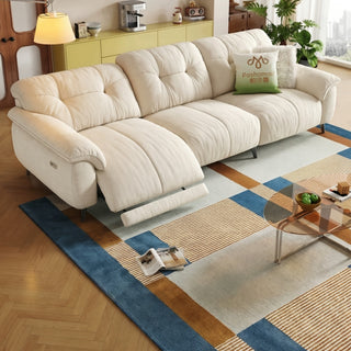 Cream cat-scratch power recliner sofa in a living room