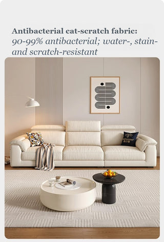 Cream cat-scratch fabric high-back sofa in a living room