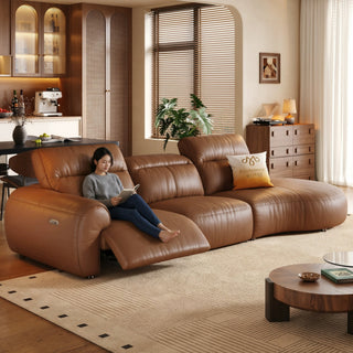 Tan leather power sofa in a living room