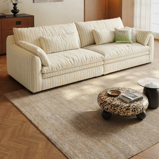 Cream striped chenille sofa in a living room