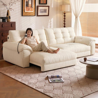 Cream chenille power sofa bed in a living room