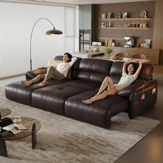 Dark-brown leather power sofa bed in a living room
