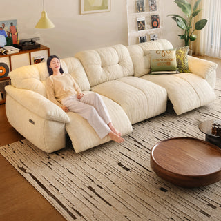 Cream chenille power recliner sofa in a living room