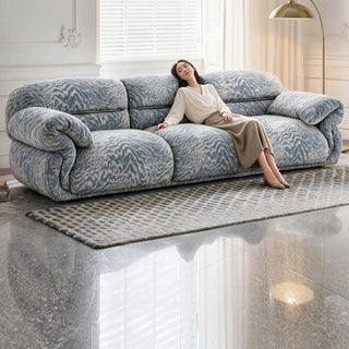 Blue textured chenille sofa in a living room