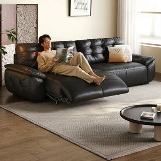 Black leather power recliner sofa in a living room