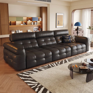 Black leather power sofa bed in a living room